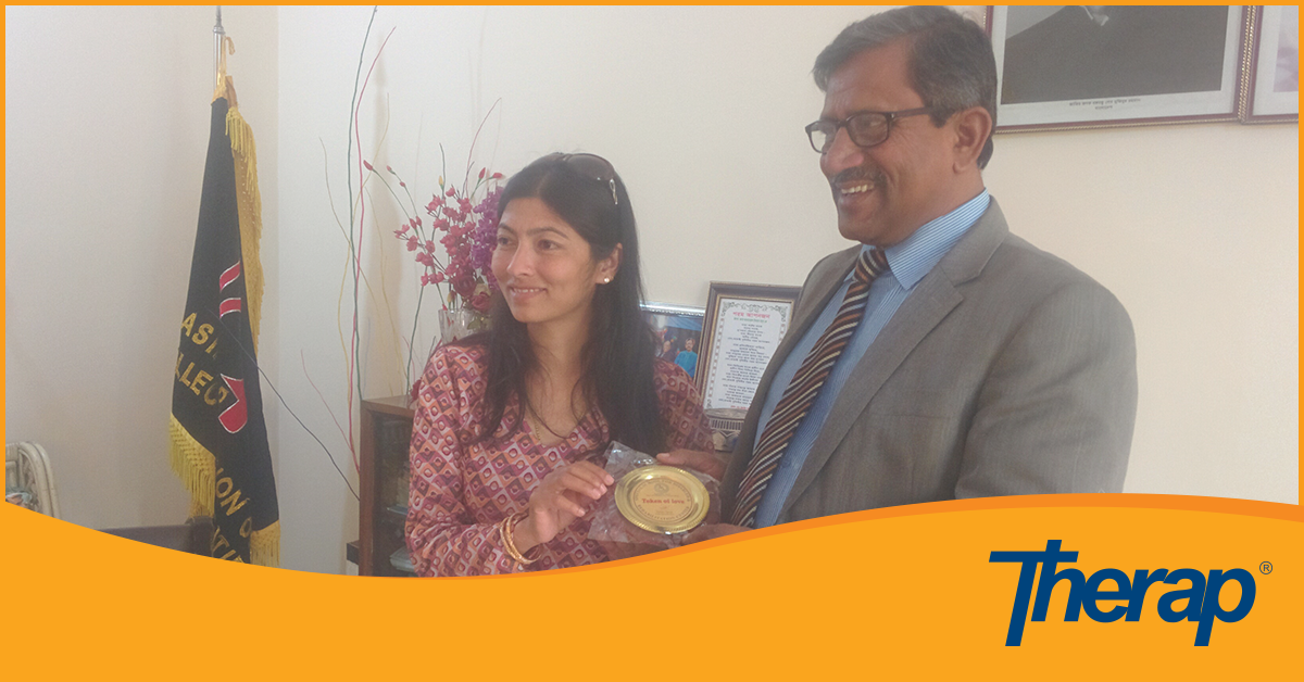 Ms. Sabita Upreti presenting a token of love from SSDRC to the President of AFID, Mr. Jowaherul Islam Mamun