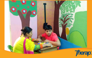 A special teacher is teaching an special need children in Blue Bird Special School, Dhaka