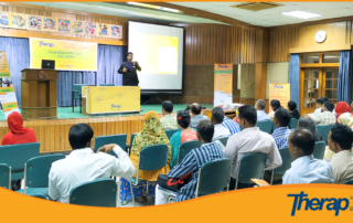 Therap Global training and implementation specialist is giving his presentation on stage in Rangpur workshop