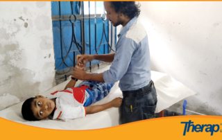 A therapist of Anuvob Autism and Buddhi Protibondhi Biddaloy providing Therapy to a special child