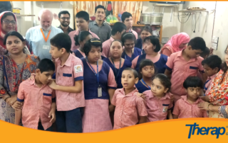 Therap Global team is taking a group picture with all the special need children and teachers of Angels Care Foundation